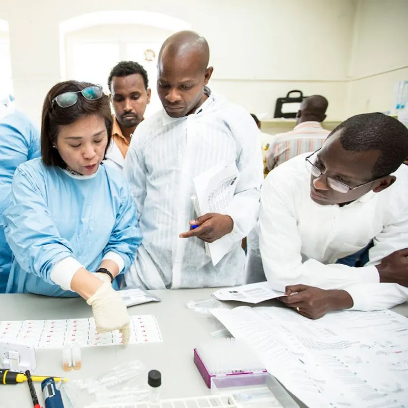 This is Jennifer from the Research Institute for Tropical Medicine (RITM) in the Philippines, demonstrating lot testing of a malaria rapid diagnostic test (RDT), at a workshop in Addis Ababa, Ethiopia, in 2016. © FIND/J.Rae