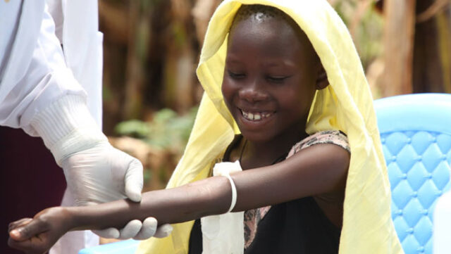 Child giving a blood sample to test for schistosomiasis in Kenya FIND/George Muiruri 2021