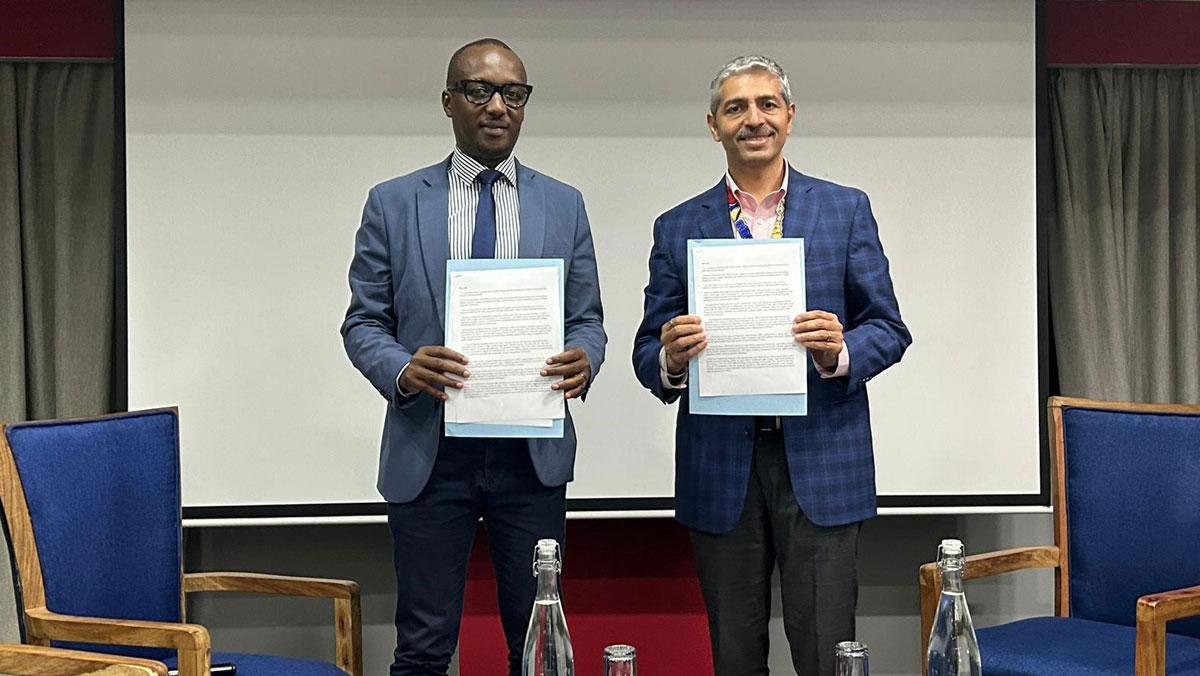 Professor Claude Mambo Muvunyi, Director General of RBC, and Dr Sanjay Sarin, VP Access, FIND, present the signed agreement between RBC and FIND in Lusaka, Zambia, on the sidelines of the 3rd International Conference on Public Health (CPHIA)